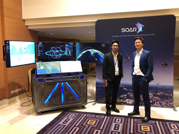 Mr. Wasanchai VONGSANTIVANICH (right) and Mr. Panupat HORMA (left) at the Sentinel Asia café exhibition corner during the JPTM 2019 hosted by ADPC